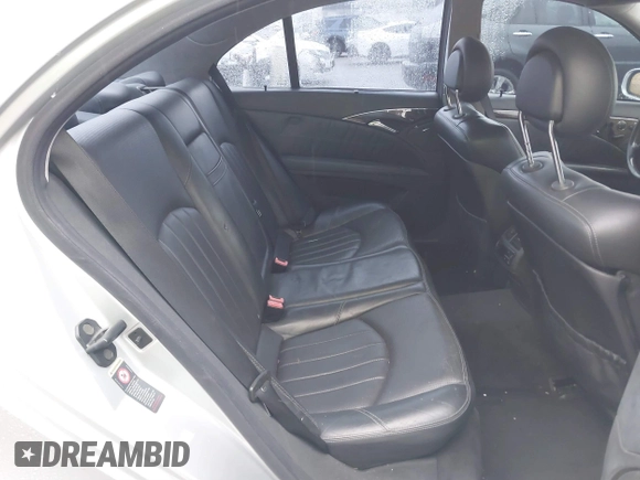 2003 Mercedes-Benz E-Class 5.5L AMG with VIN WDBUF76J93A351317, listed as a IAAI auction lot 41573446 with 144,119 mi miles. Bid and sale history available at carsss.com. Image 8.