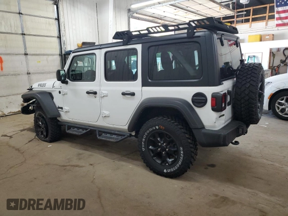 2022 Jeep Wrangler Unlimited Willys with VIN 1C4HJXDM0NW244953, listed as a Copart auction lot 71495154 with 14,577 mi miles and Salvage Title. Bid and sale history available at DreamBid. Image 2.