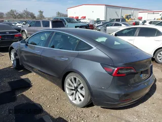 2020 Tesla Model 3 Long Range with VIN 5YJ3E1EB6LF666624, listed as a IAAI auction lot 41720664 with 65,973 mi miles. Bid and sale history available at carsss.com. Image 3.
