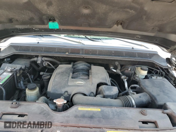 2006 Nissan Titan SE z VIN 1N6BA06A66N569501, wystawiony jako Copart lot #59872455 z przebiegiem 80 057 mil mil oraz Szkoda całkowita • Salvage title. Historia ofert i sprzedaży dostępna na DreamBid. Obrazek 11.