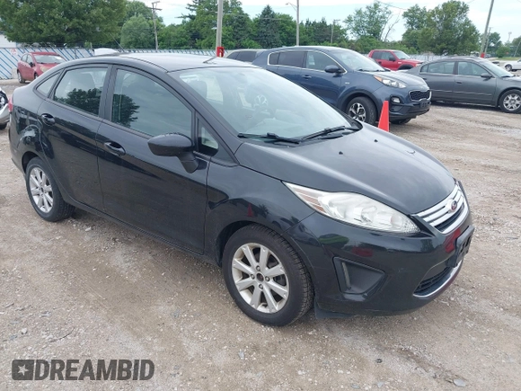 2011 Ford Fiesta SE z VIN 3FADP4BJ3BM147784, wystawiony jako IAAI lot #42567083 z przebiegiem 104 843 mil mil oraz . Historia ofert i sprzedaży dostępna na DreamBid. Obrazek 1.