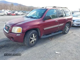 2004 GMC Envoy SLE with VIN 1GKDS13S342287315, listed as a IAAI auction lot 41486715 with 186,129 mi miles. Bid and sale history available at carsss.com. Image 2.