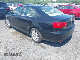 2014 Volkswagen Jetta SE with VIN 3VWD17AJ4EM429576, listed as a IAAI auction lot 42542604 with 142,313 mi miles and . Bid and sale history available at DreamBid. Image 3.