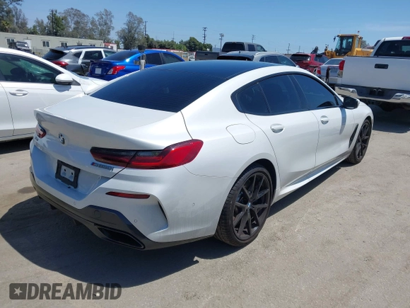 2022 BMW 8 Series M850i z VIN WBAGV8C02NCH87808, wystawiony jako IAAI lot #42255995 z przebiegiem 34 285 mil mil oraz . Historia ofert i sprzedaży dostępna na DreamBid. Obrazek 4.