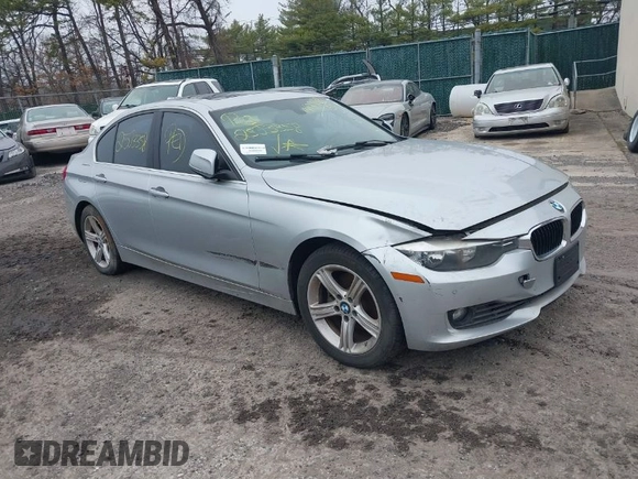 2015 BMW 3 Series 328i xDrive with VIN WBA3B5G57FNS12490, listed as a IAAI auction lot 41927689 with 999,999 mi miles. Bid and sale history available at carsss.com. Image 1.