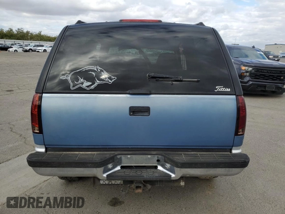 1995 GMC Yukon with VIN 1GKEK18K6SJ710419, listed as a Copart auction lot 80778474 with 215,789 mi miles and Salvage Title. Bid and sale history available at carsss.com. Image 6.