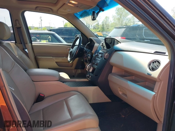2012 Honda Pilot Touring with VIN 5FNYF4H9XCB083406, listed as a IAAI auction lot 42107651 with 217,678 mi miles. Bid and sale history available at carsss.com. Image 5.
