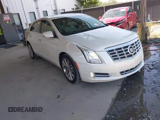 2014 Cadillac XTS Luxury with VIN 2G61M5S31E9124761, listed as a IAAI auction lot 42604301 with 153,127 mi miles and . Bid and sale history available at DreamBid. Image 1.