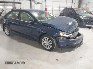 2014 Volkswagen Jetta SE with VIN 3VWD17AJ1EM397265, listed as a IAAI auction lot 41090997 with 68,877 mi miles and . Bid and sale history available at DreamBid. Image 1.