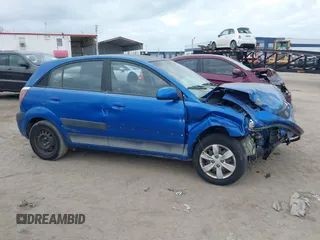 2009 Kia Rio LX with VIN KNADE243296494243, listed as a IAAI auction lot 41307888 with 133,487 mi miles. Bid and sale history available at carsss.com. Image 13.