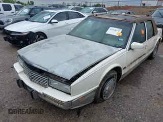 1990 Cadillac Seville z VIN 1G6KY533XLU803161, wystawiony jako IAAI lot #42164352 z przebiegiem Nie podano mil oraz . Historia ofert i sprzedaży dostępna na DreamBid. Obrazek 6.