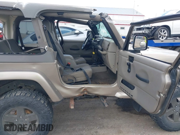 2004 Jeep Wrangler Sahara with VIN 1J4FA59S54P740417, listed as a IAAI auction lot 42382078 with 200,108 mi miles and . Bid and sale history available at DreamBid. Image 5.