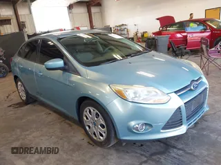 2012 Ford Focus SE z VIN 1FAHP3F20CL216223, wystawiony jako IAAI lot #42643351 z przebiegiem 155 501 mil mil oraz . Historia ofert i sprzedaży dostępna na DreamBid. Obrazek 1.