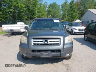 2007 Honda Pilot EX-L z VIN 2HKYF18677H504266, wystawiony jako IAAI lot #42467499 z przebiegiem 214 717 mil mil oraz . Historia ofert i sprzedaży dostępna na DreamBid. Obrazek 13.