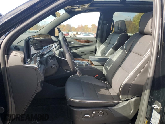 2024 Cadillac Escalade 4WD Premium Luxury with VIN 1GYS4BKL1RR181502, listed as a Copart auction lot 77155704 with 6,588 mi miles and Salvage title. Bid and sale history available at DreamBid. Image 7.