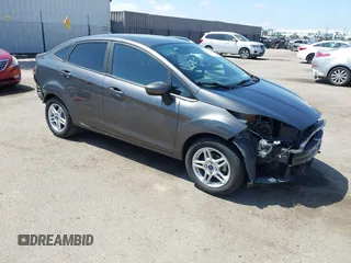 2017 Ford Fiesta SE z VIN 3FADP4BJ9HM125975, wystawiony jako IAAI lot #42174562 z przebiegiem 55 661 mil mil oraz . Historia ofert i sprzedaży dostępna na DreamBid. Obrazek 1.