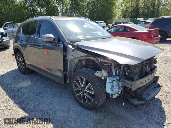 2018 Mazda CX-5 Grand Touring with VIN JM3KFBDM5J0373351, listed as a Copart auction lot 59395945 with Not provided miles and Salvage title. Bid and sale history available at DreamBid. Image 4.