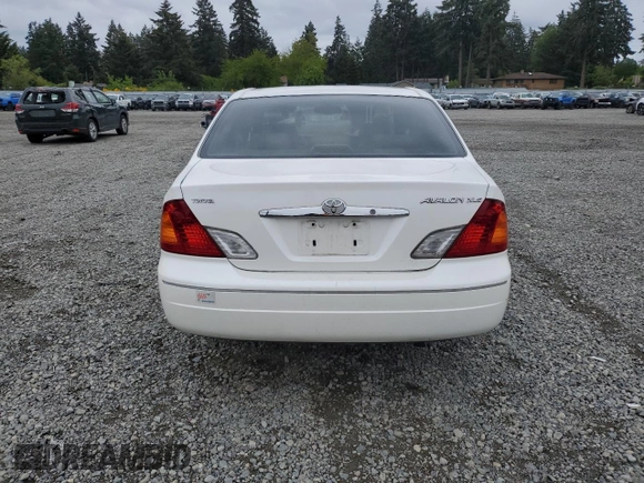 2001 Toyota Avalon XL z VIN 4T1BF28B31U136069, wystawiony jako Copart lot #57355025 z przebiegiem 217 489 mil mil oraz Szkody całkowita. Historia ofert i sprzedaży dostępna na DreamBid. Obrazek 6.