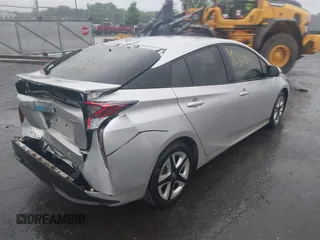 2017 Toyota Prius Two with VIN JTDKARFU4H3043433, listed as a IAAI auction lot 42310201 with 50,715 mi miles and . Bid and sale history available at DreamBid. Image 4.