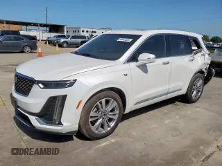 2024 Cadillac XT6 FWD Premium Luxury with VIN 1GYKPCRS7RZ711983, listed as a Copart auction lot 64842625 with 6,394 mi miles and Clean title. Bid and sale history available at DreamBid. Image 1.