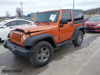 2011 Jeep Wrangler Sport with VIN 1J4AA2D16BL589390, listed as a IAAI auction lot 41478801 with 153,013 mi miles. Bid and sale history available at carsss.com. Image 2.