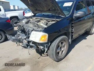 2004 GMC Envoy SLE with VIN 1GKDS13S942294303, listed as a IAAI auction lot 41992547 with 196,444 mi miles. Bid and sale history available at carsss.com. Image 6.