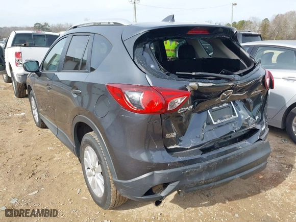 2016 Mazda CX-5 Touring with VIN JM3KE2CY0G0792756, listed as a IAAI auction lot 41349291 with NaN miles. Bid and sale history available at carsss.com. Image 3.
