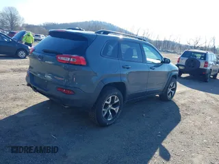 2014 Jeep Cherokee Trailhawk with VIN 1C4PJMBS4EW179763, listed as a IAAI auction lot 41988048 with 152,681 mi miles. Bid and sale history available at carsss.com. Image 4.