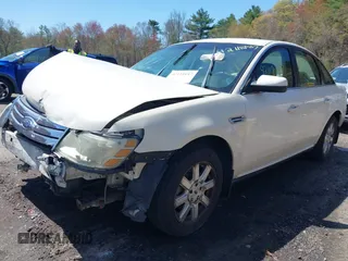 2009 Ford Taurus SE with VIN 1FAHP23W89G113022, listed as a IAAI auction lot 42118187 with 135,319 mi miles. Bid and sale history available at carsss.com. Image 2.