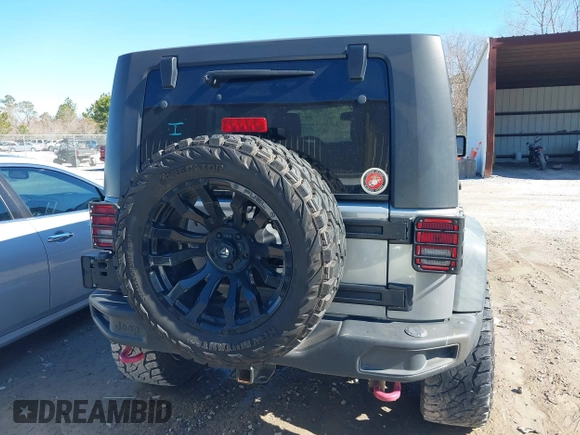 2015 Jeep Wrangler Unlimited Rubicon Hard Rock with VIN 1C4HJWFG2FL587607, listed as a IAAI auction lot 41419237 with 109,719 mi miles and . Bid and sale history available at DreamBid. Image 16.