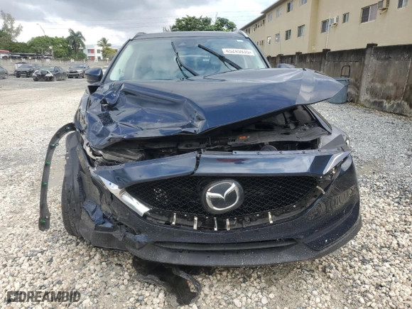 2021 Mazda CX-5 Grand Touring Reserve with VIN JM3KFBAY0M0414464, listed as a Copart auction lot 45245935 with 24,549 mi miles and Non Repairable. Bid and sale history available at carsss.com. Image 5.