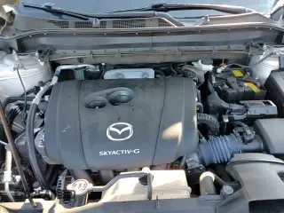 2024 Mazda CX-5 S Select z VIN JM3KFBBL6R0502168, wystawiony jako Copart lot #71203895 z przebiegiem 25 049 mil mil oraz Szkoda całkowita • Salvage title. Historia ofert i sprzedaży dostępna na DreamBid. Obrazek 13.