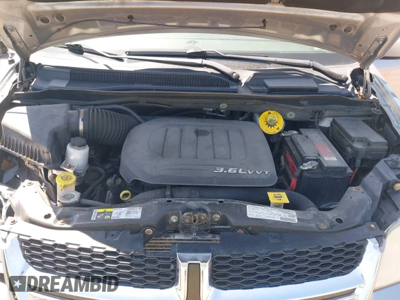 2013 Dodge Grand Caravan Crew with VIN 2C4RDGDG1DR800538, listed as a IAAI auction lot 42211140 with 138,647 mi miles and . Bid and sale history available at DreamBid. Image 10.