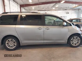 2015 Toyota Sienna XLE with VIN 5TDYK3DCXFS534633, listed as a IAAI auction lot 42018593 with 128,421 mi miles. Bid and sale history available at carsss.com. Image 13.