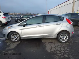 2019 Ford Fiesta SE z VIN 3FADP4EJ7KM147864, wystawiony jako IAAI lot #41692160 z przebiegiem 87 417 mil mil oraz . Historia ofert i sprzedaży dostępna na DreamBid. Obrazek 14.