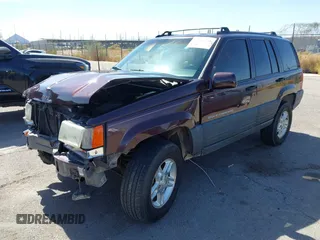 1996 Jeep Grand Cherokee Laredo with VIN 1J4GZ58S3TC391942, listed as a IAAI auction lot 41711778 with 202,765 mi miles. Bid and sale history available at carsss.com. Image 2.