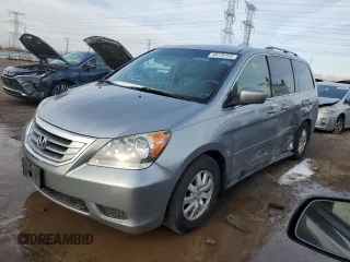 2010 Honda Odyssey EX-L with VIN 5FNRL3H69AB001952, listed as a Copart auction lot 49738155 with 95,721 mi miles and Salvage Title. Bid and sale history available at carsss.com. Image 1.