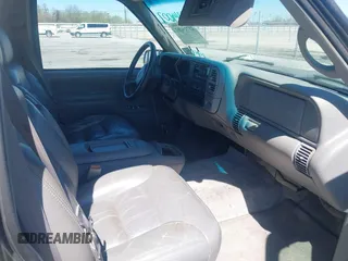 1999 Chevrolet Suburban with VIN 3GNEC16R9XG253081, listed as a IAAI auction lot 41719007 with 196,884 mi miles. Bid and sale history available at carsss.com. Image 5.