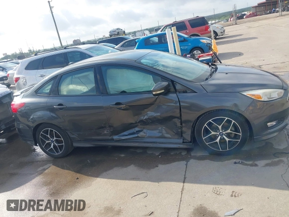 2016 Ford Focus SE z VIN 1FADP3F28GL360512, wystawiony jako IAAI lot #42427723 z przebiegiem 217 172 mil mil oraz . Historia ofert i sprzedaży dostępna na DreamBid. Obrazek 13.