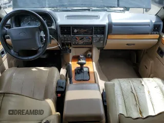 1995 Land Rover Range Rover County Classic z VIN SALHE1243SA659366, wystawiony jako Copart lot #56952765 z przebiegiem 218 223 mil mil oraz Szkoda całkowita • Salvage title. Historia ofert i sprzedaży dostępna na DreamBid. Obrazek 8.