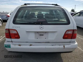 1999 Mercedes-Benz E-Class with VIN WDBJH65F3XA749696, listed as a Copart auction lot 77656084 with 163,802 mi miles and Salvage Title. Bid and sale history available at carsss.com. Image 6.
