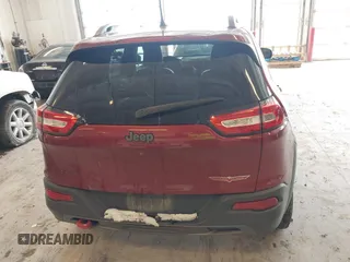 2016 Jeep Cherokee Trailhawk with VIN 1C4PJMBBXGW135138, listed as a IAAI auction lot 41595718 with 267,058 mi miles and . Bid and sale history available at DreamBid. Image 16.