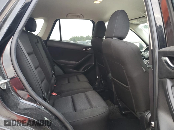 2015 Mazda CX-5 Touring with VIN JM3KE4CYXF0446370, listed as a Copart auction lot 52392575 with 132,419 mi miles and Salvage Title. Bid and sale history available at DreamBid. Image 11.