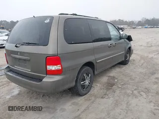 2005 Kia Sedona LX with VIN KNDUP132056674430, listed as a IAAI auction lot 41553321 with 136,734 mi miles. Bid and sale history available at carsss.com. Image 4.