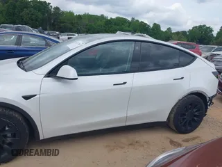 2021 Tesla Model Y Long Range with VIN 5YJYGDEE7MF198867, listed as a IAAI auction lot 42117463 with 79,759 mi miles and . Bid and sale history available at DreamBid. Image 14.