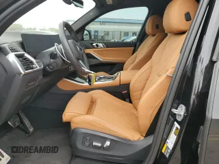 2024 BMW X5 xDrive50e with VIN 5UX43EU02R9U91727, listed as a Copart auction lot 64155574 with 7,050 mi miles and Salvage Title. Bid and sale history available at carsss.com. Image 7.