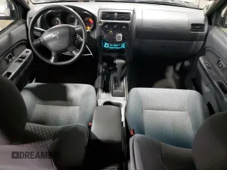 2004 Nissan Xterra XE with VIN 5N1ED28YX4C650888, listed as a Copart auction lot 57151695 with 142,210 mi miles and Salvage title. Bid and sale history available at DreamBid. Image 8.