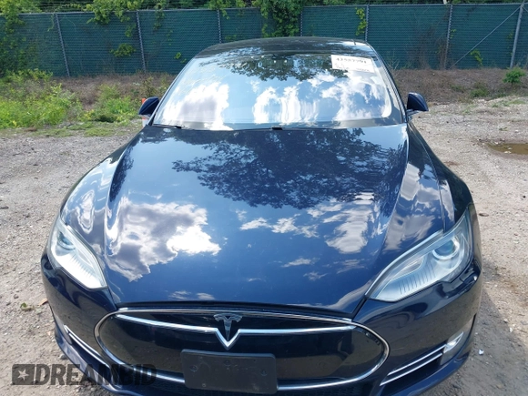 2013 Tesla Model S with VIN 5YJSA1CN0DFP21851, listed as a IAAI auction lot 42557791 with 106,328 mi miles and . Bid and sale history available at DreamBid. Image 13.