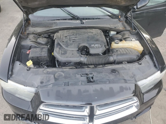 2013 Dodge Charger SE with VIN 2C3CDXBG9DH512172, listed as a Copart auction lot 60943214 with 125,163 mi miles and Salvage Title. Bid and sale history available at DreamBid. Image 11.