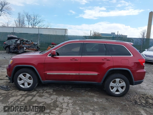 2012 Jeep Grand Cherokee Laredo with VIN 1C4RJFAG7CC221682, listed as a IAAI auction lot 41881922 with 218,762 mi miles. Bid and sale history available at carsss.com. Image 14.